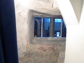 The anchorite's cell in St Anne's Church, Lewes, East Sussex, shows the window onto the chancel.