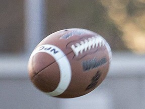 Quarterback Ethan Andrew snaps the ball during a practice as the North Park Trojans senior football team gets ready for their CWOSSA games. Photographed on Wednesday November 14, 2018 in Brantford, Ontario. Brian Thompson/Brantford Expositor/Postmedia Network ORG XMIT: POS1811141657405731