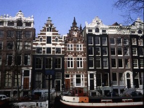 Amsterdam's iconic canal houses became tall and narrow because taxes were based on canal frontage, writes columnist Rick Gamble. Postmedia