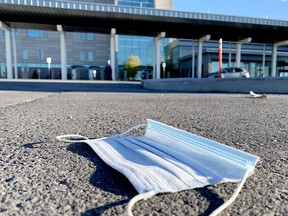 A disposabe mask lies in the parking lot at Brockville General Hospital on Friday afternoon, Nov. 5, 2021. (FILE PHOTO)