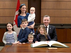 Leeds-Grenville-Thousand Islands and Rideau Lakes MP Michael Barrett poses with his family as he is sworn in on Monday. (SUBMITTED PHOTO)