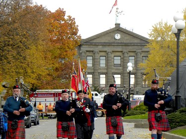 Pipers lead the Royal Canadian Legion Colour Party down Court House Avenue to strart Brockville's Remembrance Day ceremony. (RONALD ZAJAC/The Recorder and Times)