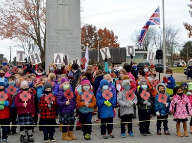 Students from The St. Lawrence Academy gather in front of the cenotaph at Fort Wellington in Prescott after the 2021 Remembrance Day ceremony on Thursday morning.
(TIM RUHNKE/The Recorder and Times)
