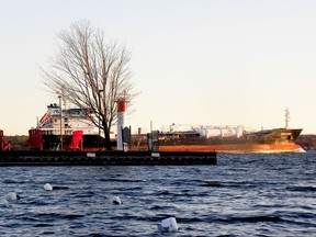 Plastic-bottle buoys remain in the area once occupied by the Fuller Marine docks at Ernie Fox Quay as the oil and chemical tanker Hinch Spirit heads upriver on Friday afternoon, Nov. 12, 2021. (RONALD ZAJAC/The Recorder and Times)