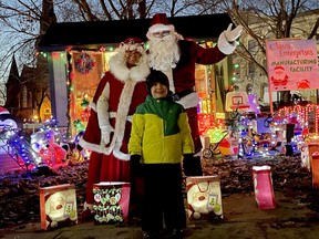 Four-year-old Elliott has clearly been a good boy as he got to pose with Santa and Mrs. Claus during Brockville's static Santa-Claus parade on Saturday. Amid the many uncertainties of the COVID-19 pandemic, the festive season remains. (MARSHALL HEALEY/The Recorder and Times)