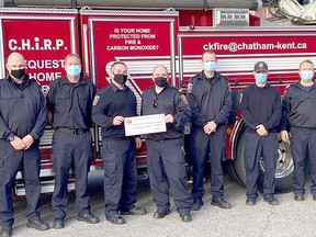 Local firefighters are seen here with a donation from Enbridge Gas for training materials to enhance life-saving techniques. Handout