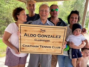 The Chatham Tennis Club has renamed its clubhouse to honour long-time volunteer Aldo Gonzalez. He's shown with family members at a plaque presentation ceremony. Supplied