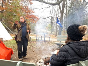 John Basden, of TJ Stables, speaks to visitors about the Indigenous commemorative fire, lit in honour of The Gift, a charitable initiative that took place throughout Chatham-Kent on Nov. 20. Trevor Terfloth/Postmedia