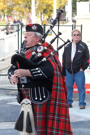 Br. 642 Royal Canadian Legion Pipe Band member Walter Tomaszewski plays the bagpipes during a Remembrance Day ceremony at the cenotaph in downtown Chatham on Thursday.