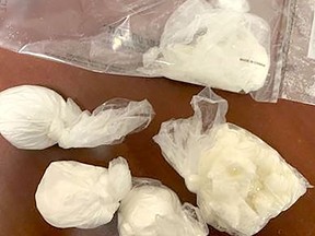 A Chatham man is facing drug charges after found to be in possession of suspected methamphetamine, cocaine and oxycontin, seen here,  with an estimated street value of $23,100, when pulled over by Chatham-Kent police Sunday night.