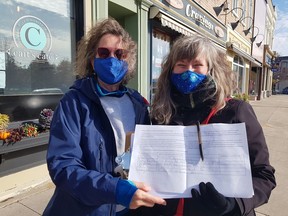 Betty Durst of Blue Bayfield, left, and Susan Hundertmark of C4th Climate spent the morning of Nov. 6 collecting signatures for a nation-wide Council of Canadians' petition that urges action on climate change and a just transition from a fossil fuel economy. Handout