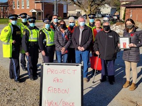 OPP officers along with volunteers from the Huron-Bruce Mothers Against Drunk Driving (MADD) chapter launched Project Red Ribbon with a Reduce Impaired Driving Everywhere (RIDE) program in Wingham. Supplied