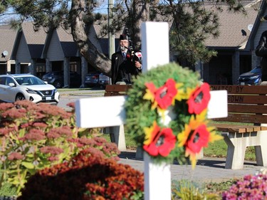 Piper and veteran Ken Stephens, pictured behind a display at the Ingleside Cenotaph. Photo on Sunday, November 7, in Ingleside, Ont. Todd Hambleton/Cornwall Standard-Freeholder/Postmedia Network