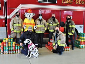 Members of the South Stormont Fire Department pose proudly with the many donations that they collected on Saturday November 20, 2021 in St. Andrews West, Ont. Francis Racine/Cornwall Standard-Freeholder/Postmedia Network