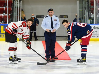 Cornwall Colts Kobe Tallman and Nepean Raiders Coleman Bennett in the ceremonial faceoff prior to play on Thursday November 11, 2021 in Cornwall, Ont. Cornwall lost 8-6. Robert Lefebvre/Special to the Cornwall Standard-Freeholder/Postmedia Network