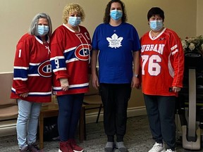 Pictured on jersey day at Sandfield Place are Debra Ann L'Ecuyer, activity staff person Debbie Poirier, PSW Roxanne Beauchamps, and housekeeping staff Maggie Grant, on Friday November 19, 2021 in Cornwall, Ont. 
Debra Ann L'Ecuyer/Special to the Cornwall Standard-Freeholder/Postmedia Network