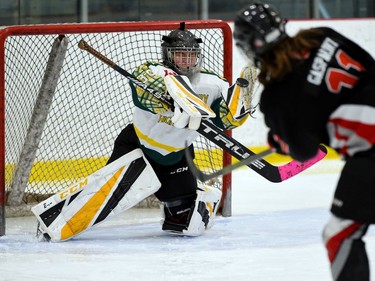 The Glengarry Highlanders U18 goaltender moves to glove a shot from this Nepean Wildcats player on Saturday November 13, 2021 in Cornwall, Ont. Glengarry won 4-1. Robert Lefebvre/Special to the Cornwall Standard-Freeholder/Postmedia Network
