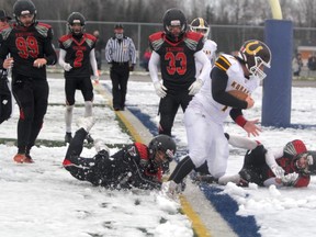 Korah Colts quarterback Ryan Barnes scores the first touchdown of the game on this 12-yard run. The Colts added four more touchdowns in a 35-7 victory over the St. Ignatius Faclons in the Northern Bowl on Saturday afternoon at Superior Heights.