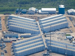 An aerial view of PTI Beaver River Executive Lodging oilsands work camp near Fort McKay, Alta. on June 18, 2013. Ryan Jackson/Postmedia Network