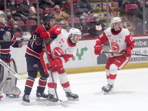 Soo Greyhounds forward Tye Kartye gets roughed up by Guelph Storm defenceman Cam Allen during an Ontario Hockey League game at the GFL Memorial Gardens. The Hounds spotted the Storm a 6-2 lead on Saturday night before rallying for three third-period goals. However, the comeback came up one goal short in a 6-5 loss to the Storm.