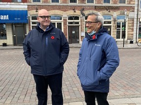 Ontario Liberal Leader Steven Del Duca, left, and Kingston and the Islands Liberal candidate Ted Hsu met with Queen's University students and basic income advocates in Kingston's Springer Market Square on Wednesday.