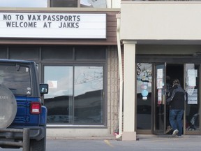 Customers enter J.A.K.K. Tuesdays Sports Pub on Thursday afternoon in Kingston.