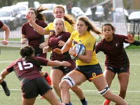 Queen's Gaels' Sophie de Goede runs against the McMaster Marauders in Ontario University Athletics women's rugby action at Nixon Field in Kingston on Oct. 23.