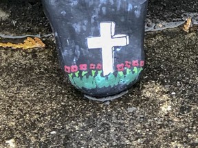 The cenotaph was covered in poppies and this painted rock, even though the Remembrance Day ceremony at Capt. Matthew J. Dawe Memorial Legion Branch 631 was moved from the cenotaph to outside the legion in Kingston on Nov. 11, 2020.
