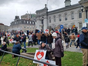 Protesters gather outside Kingston City Hall as part of the "Fight for Freedom" rally against vaccine and mask mandates on Sunday.