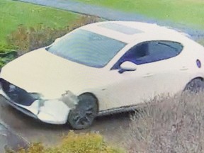 Kingston Police are searching for the driver of this white Mazda after nine incidents of dangerous driving were reported this week.