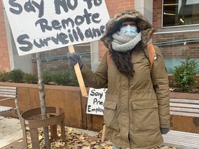 Natacha Lees, seen outside the Central Branch of the Kingston Frontenac Public Library, is protesting a pilot project that would see non-staffed "extended hours" at KFPL's Pittsburgh Branch.