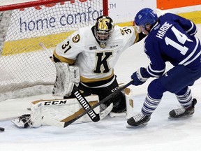 Kingston Frontenacs goaltender Leevi Merilainen makes a save on Mississauga Steelheads forward James Hardie in Ontario Hockey League action at the Leon's Centre in Kingston on Wednesday.