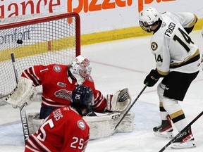 Kingston Frontenacs forward Jordan Frasca tips the puck past Oshawa Generals goalie Patrick Leaver in Ontario Hockey League action at the Leon's Centre in Kingston on Friday, Nov. 12, 2021. Ian MacAlpine/The Kingston Whig-Standard/Postmedia Network