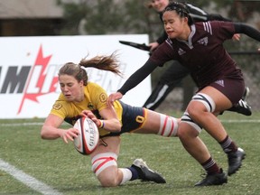 Queen's Gaels' Sophie de Goede dives to get her hands on a try before the ball bounces through the end zone during the U Sports women's rugby championship game at Nixon Field on Sunday. Queen's defeated the Ottawa Gee-Gees, 26-18, to win the program's first national championship.