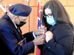 Seeley's Bay Legionnaire and centenarian Russ Thompson presented first poppy to Mayor Corinna Smith-Gatcke in Township of Leeds and the Thousand Islands. Supplied by Janet Gaylord