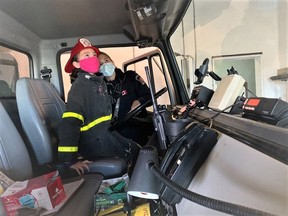 Central School's Presley learned what it is like to be a firefighter from Firefighter Kristie Czovek. Presley was one of four winners of Chief of the Day.