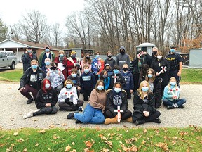 Photo supplied
Students from Our Lady of Fatima Catholic School helped members of the Royal Canadian Legion Branch 561 lay crosses at Woodlands Cemetery.