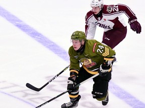 Ty Nelson of the North Bay Battalion carries the puck away from Jaden Reyers of the Peterborough Petes in the teams' Ontario Hockey League game Thursday night. The Troops continue a three-game weekend road trip Friday night against the Kingston Frontenacs.
Sean Ryan Photo