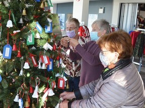 The Bells of Christmas are back in the lobby at the Harry Lumley Bayshore Community Centre. The initiative allows people to take one of the crocheted bells from the tree, which has a name of a local long-term care or nursing home resident and three gift suggestions attached. They then purchase a gift, wrap it and return it so it can be given to the person at Christmastime. Helping to decorate the tree on Friday, Novembe are, from left, Carol Davenport, Lee Anne O'Leary and Styn Furness.