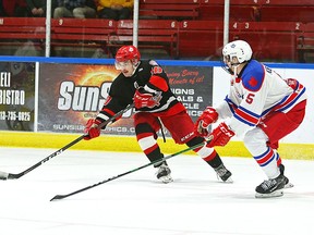 Pembroke Lumber Kings' forward Gabe Malek gets around the Rockland Nationals' Wyatt Kennedy on the way to scoring his second goal of the game in the third period. The Kings doubled the Nationals 6-3.