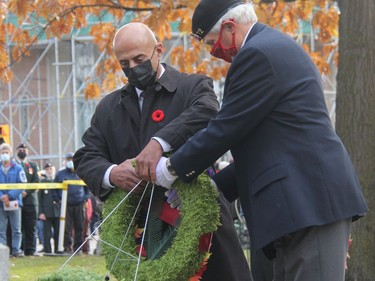 Escorted by Branch 72 First Vice-President Romeo Levasseur, right, Hani Diab prepares to lay a wreath on Remembrance Day at the cenotaph in Pembroke. Diab's son, 22-year-old Trooper Marc Diab, with the Petawawa-based Royal Canadian Dragoons, was killed in 2009 when an Improvised Explosive Device (IED) detonated near his reconnaissance armoured vehicle during a patrol in the mountainous Shah Wali Kot district, north of Kandahar City. Anthony Dixon