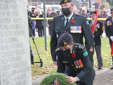 During the Remembrance Day ceremony in Pembroke, Chief Warrant Officer Pete Thibault escorted commanding officer of 42nd Field Artillery Regiment (Lanark and Renfrew Scottish) Lt.-Col. Jen Causey as she placed a wreath before the cenotaph. Anthony Dixon
