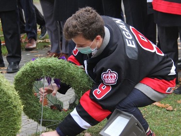 Pembroke Lumber Kings Captain Brady Egan places a wreath at the cenotaph during the Remembrance Day ceremony Thursday morning. Anthony Dixon