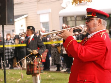 Pembroke Legion Brand trumpeter Gord Tapp plays the Last Post before Pipe Major Randy Briand plays the lament during the Remembrance Day ceremony at the Pembroke cenotaph. Anthony Dixon