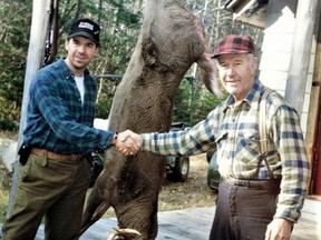 The author and his father, Rathwell, pose with the trophy whitetail buck taken at their hunt camp in 1996. Submitted photo