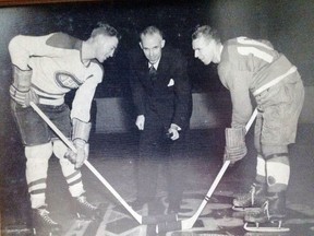 NHL President Clarence Campbell drops the ceremonial puck between Ken Mosdell of the Montreal Canadiens and Jack Carthy of the Pembroke Senior Lumber Kings on opening night of the Pembroke Memorial Centre, Nov. 14, 1951.