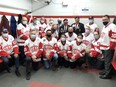 Pembroke Lumber Kings' alumni from the past seven decades were on hand to mark the 70th anniversary of the Pembroke Memorial Centre on Nov. 14. Taking part in the pre-game ceremony were (back from left) Reid Mick, Don Stresman, Dave Stresman, Father Pat Blake, Pembroke Mayor Mike LeMay, Pembroke Legion president Stan Halliday, Pembroke Legion first vice-president Romeo Levasseur, Larry Mick, (middle from left) Pat Hahn, Robb Wilson, Nathan Sell and (front from left) Frank Rodgers (Lumber Kings anthem singer-1980s), Robert Levasseur, Sean Crozier, Brandon Gagne, Matt Gagne, Chris Osborne and Luc Chabot (standing).