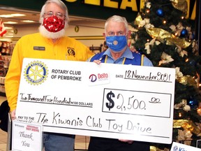 The Kiwanis Club of Pembroke received a $2,500 donation from the Rotary Club of Pembroke to kickstart the Kiwanis Christmas Toy and Food Drive during the Nov. 18 kick off at the Pembroke Mall. Taking part in the cheque presentation were Kiwanis Club president Robert Lauder (left) and Rotary Club president Dave Foohey.