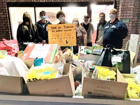 Volunteers who participated in the annual Trick or Eat food drive show off one of the trailers of food donations collected on Halloween night for the Petawawa Pantry Food Bank.