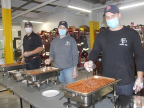 A trio of the newer firefighters with the Pembroke Fire Department, from left, Riley Poirier, Emma Gibbon and Tanner Rutz, are bringing the heat during the P.F.D. Chili Fest hosted by the members of the Pembroke Professional Firefighters Association. The event, held this year on Nov. 17, raises money for local charities. Totals and beneficiaries weren't available at press time but organizer Jason Kelly said to watch for some exciting announcements in the next few weeks. Anthony Dixon